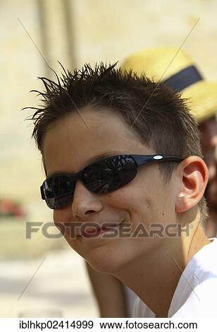 Boy, 12, wearing sunglasses, with gel in his hair, portrait View Large Photo Image Stock Photo - Boy, 12, wearing sunglasses, with gel in his hair, portrait. Fotosearch