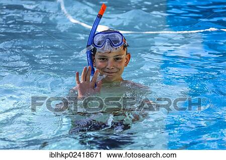 Boy, 12 years old, wearing diving goggles and a snorkel in a pool View Large Photo Image Stock Image - Boy, 12 years old, wearing diving goggles and a snorkel in a pool. Fotosearch