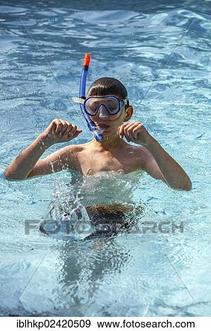 Boy, 12 years, with diving goggles in a pool, Cote d'Azur, France, Europe View Large Photo Image Stock Photo - Boy, 12 years, with diving goggles in a pool, Cote d'Azur, France, Europe. Fotosearch