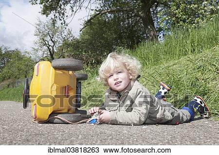 "Boy, 3, playing with his Bobby-Car" View Large Photo Image Stock Image - "Boy, 3, playing with his Bobby-Car". Fotosearch