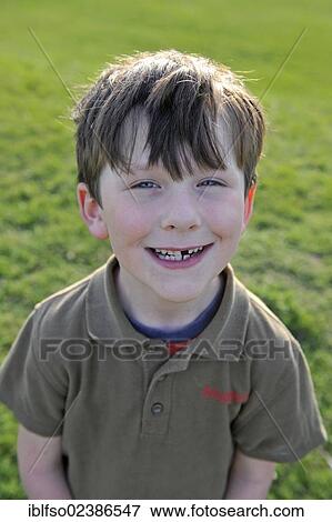 "Boy, 7, showing his tooth gap, Thuringia, Germany, Europe" View Large Photo Image Stock Photo - "Boy, 7, showing his tooth gap, Thuringia, Germany, Europe". Fotosearch