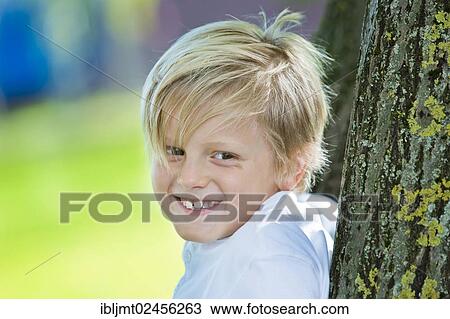 Stock Image - "Boy, 7 years old, portrait". Fotosearch