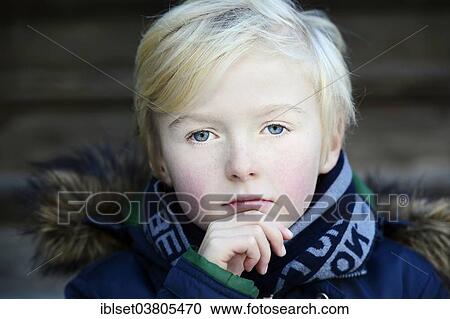 Stock Image - "Boy, 7 years, pensive, portrait". Fotosearch