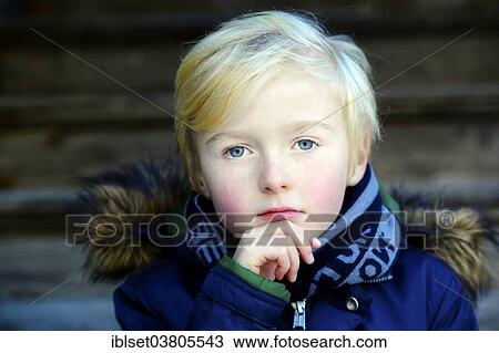 Stock Image - "Boy, 7 years, pensive, portrait". Fotosearch