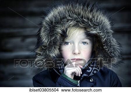 "Boy, 7 years, with a fur hood, pensive, portrait" View Large Photo Image Picture - "Boy, 7 years, with a fur hood, pensive, portrait". Fotosearch