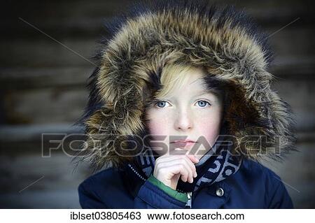 "Boy, 7 years, with a fur hood, pensive, portrait" View Large Photo Image Stock Image - "Boy, 7 years, with a fur hood, pensive, portrait". Fotosearch