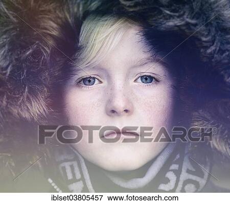 Stock Photo - "Boy, 7 years, with a fur hood, portrait". Fotosearch