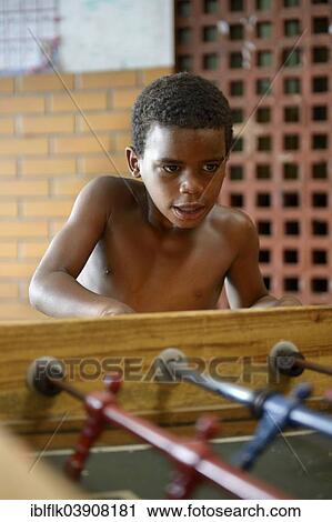 "Boy, 9, playing table football, Sao Martinho social project for street children, Lapa district, Rio de Janeiro, Rio de Janeiro State, Brazil, South America" View Large Photo Image Stock Image - "Boy, 9, playing table football, Sao Martinho social project for street children, Lapa district, Rio de Janeiro, Rio de Janeiro State, Brazil, South America". Fotosearch