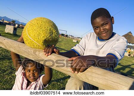 "Boy and a girl with a ball, Township, Plettenberg Bay, Garden Route, Eden District, Western Cape, South Africa, Africa" View Large Photo Image Picture - "Boy and a girl with a ball, Township, Plettenberg Bay, Garden Route, Eden District, Western Cape, South Africa, Africa". Fotosearch