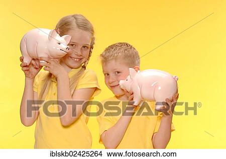 "Boy and girl, brother and sister, smiling, holding piggy banks" View Large Photo Image Picture - "Boy and girl, brother and sister, smiling, holding piggy banks". Fotosearch