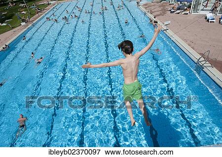 "Boy diving into a public swimming pool, Moehringer Freibad, Stuttgart, Baden-Wuerttemberg, Germany, Europe" View Large Photo Image Stock Photo - "Boy diving into a public swimming pool, Moehringer Freibad, Stuttgart, Baden-Wuerttemberg, Germany, Europe". Fotosearch