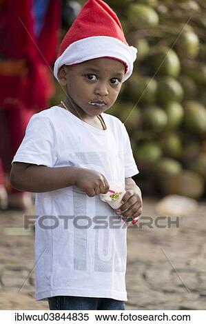 "Boy eating ice-cream, wearing a Santa Claus hat, Kochi or Cochin, Kerala, India, Asia" View Large Photo Image Stock Photography - "Boy eating ice-cream, wearing a Santa Claus hat, Kochi or Cochin, Kerala, India, Asia". Fotosearch