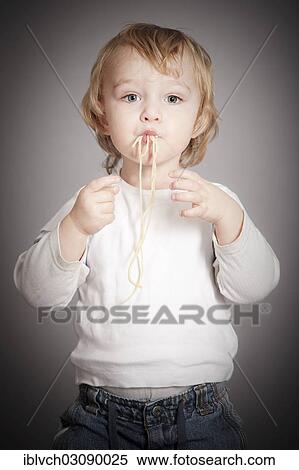 "Boy eating spaghetti, Austria, Europe" View Large Photo Image Stock Photography - "Boy eating spaghetti, Austria, Europe". Fotosearch