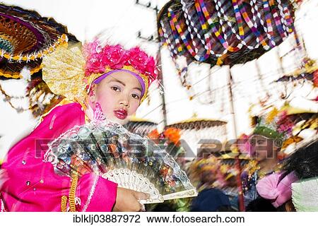 "Boy holding a fan, dressed in a bright coloured costume, at the annual Poi Sang Long festival, Mae Hong Son, Thailand, Asia" View Large Photo Image Stock Image - "Boy holding a fan, dressed in a bright coloured costume, at the annual Poi Sang Long festival, Mae Hong Son, Thailand, Asia". Fotosearch