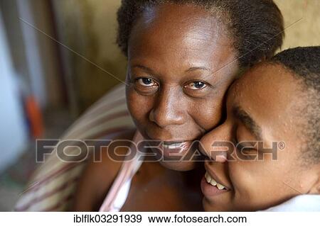 "Boy hugging his mother in the slums, favela, Jacarezinho favela, Rio de Janeiro, Rio de Janeiro State, Brazil, South America" View Large Photo Image Stock Photo - "Boy hugging his mother in the slums, favela, Jacarezinho favela, Rio de Janeiro, Rio de Janeiro State, Brazil, South America". Fotosearch