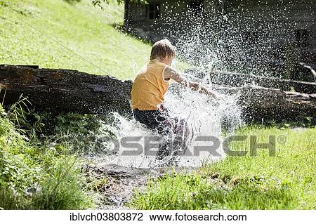 "Boy jumping into a stream, Tyrol, Austria, Europe" View Large Photo Image Stock Image - "Boy jumping into a stream, Tyrol, Austria, Europe". Fotosearch