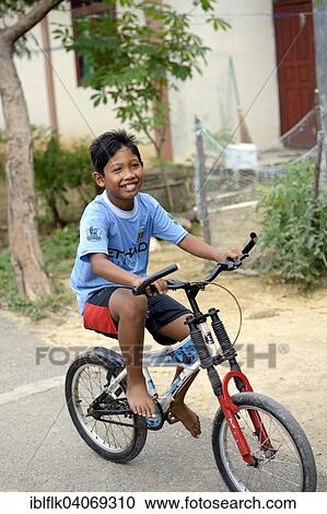 "Boy on a bicycle, Banda Aceh, Indonesia, Asia" View Large Photo Image Stock Image - "Boy on a bicycle, Banda Aceh, Indonesia, Asia". Fotosearch