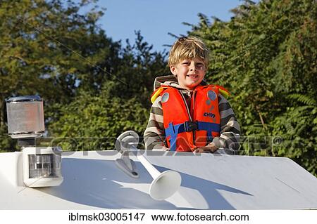 "Boy on a houseboat on the Canal du Midi, Trebes, Region Languedoc-Roussillon, France, Europe" View Large Photo Image Stock Photo - "Boy on a houseboat on the Canal du Midi, Trebes, Region Languedoc-Roussillon, France, Europe". Fotosearch