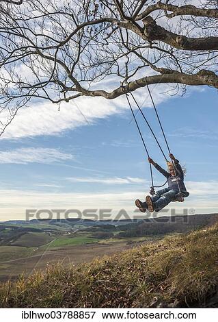 "Boy on an improvised swing, Eichenberg, Thuringia, Germany, Europe" View Large Photo Image Stock Photo - "Boy on an improvised swing, Eichenberg, Thuringia, Germany, Europe". Fotosearch