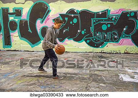"Boy playing basketball, North Rhine-Westphalia, Germany, Europe" View Large Photo Image Stock Image - "Boy playing basketball, North Rhine-Westphalia, Germany, Europe". Fotosearch