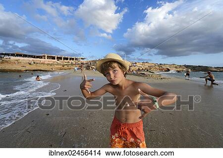 "Boy rapping on the beach in front of Cala Comte, Platges de Comte, Ibiza, Pitiusic Islands or Pine Islands, Balearic Islands, Spain, Europe" View Large Photo Image Picture - "Boy rapping on the beach in front of Cala Comte, Platges de Comte, Ibiza, Pitiusic Islands or Pine Islands, Balearic Islands, Spain, Europe". Fotosearch