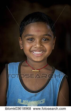 Stock Photo - "Boy, smiling, portrait, Vembanad lake, Kerala, India, Asia". Fotosearch