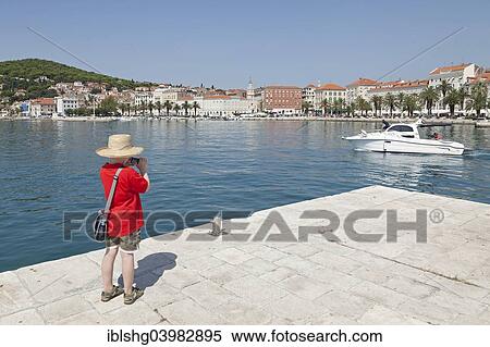 "Boy taking pictures, Promenade, Split, Dalmatia, Croatia, Europe" View Large Photo Image Stock Photography - "Boy taking pictures, Promenade, Split, Dalmatia, Croatia, Europe". Fotosearch