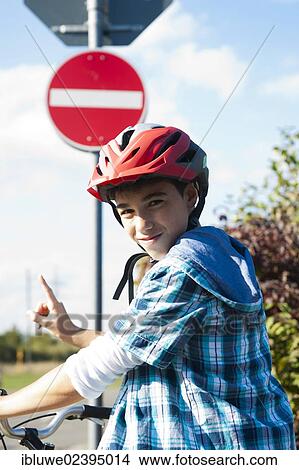 Boy wearing a bike helmet at a traffic awareness course View Large Photo Image Picture - Boy wearing a bike helmet at a traffic awareness course. Fotosearch