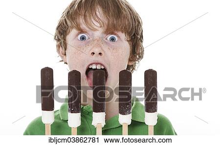 Stock Image - Boy with 5 ice lollies. Fotosearch