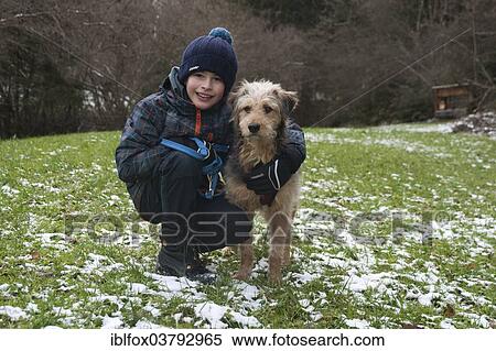 Boy with a Bosnian Coarse-haired Hound or Barak-hybrid View Large Photo Image Stock Photography - Boy with a Bosnian Coarse-haired Hound or Barak-hybrid. Fotosearch
