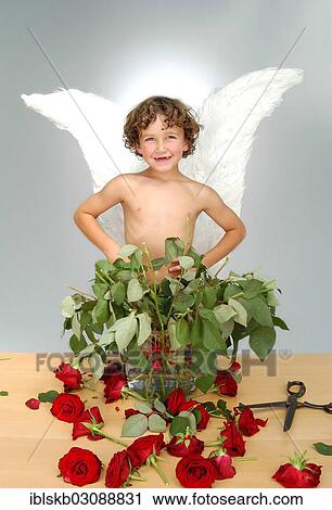"Boy with angel wings, after cutting the heads off a bouquet of roses with a large pair of scissors" View Large Photo Image Stock Image - "Boy with angel wings, after cutting the heads off a bouquet of roses with a large pair of scissors". Fotosearch
