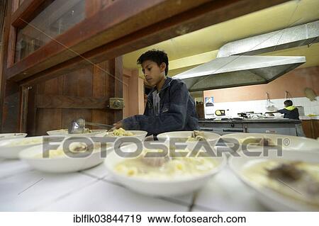 "Boy working at the food counter in the kitchen of a children's home, Ayacucho, Ayacucho region, Peru, South America" View Large Photo Image Stock Photo - "Boy working at the food counter in the kitchen of a children's home, Ayacucho, Ayacucho region, Peru, South America". Fotosearch