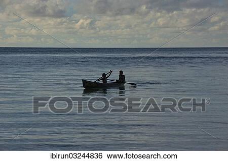 "Boys in a canoe in backlight, Marovo Lagoon, Western Province, Solomon Islands, Oceania" View Large Photo Image Stock Photograph - "Boys in a canoe in backlight, Marovo Lagoon, Western Province, Solomon Islands, Oceania". Fotosearch