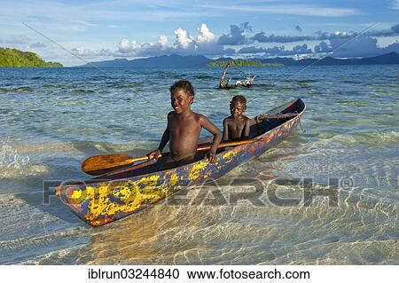 "Boys in a canoe in the Marovo Lagoon, Marovo Lagoon, Western Province, Solomon Islands, Oceania" View Large Photo Image Stock Image - "Boys in a canoe in the Marovo Lagoon, Marovo Lagoon, Western Province, Solomon Islands, Oceania". Fotosearch