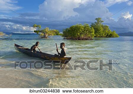 "Boys in a canoe in the Marovo Lagoon, Marovo Lagoon, Western Province, Solomon Islands, Oceania" View Large Photo Image Stock Photo - "Boys in a canoe in the Marovo Lagoon, Marovo Lagoon, Western Province, Solomon Islands, Oceania". Fotosearch