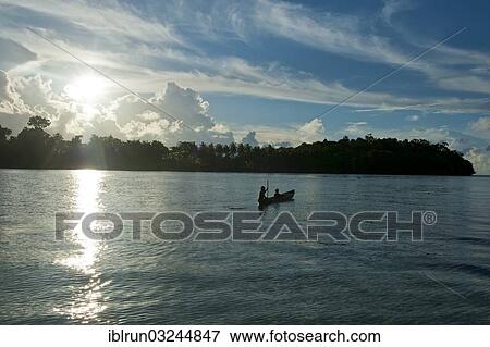 "Boys in a canoe in the Marovo Lagoon, in backlight, Solomon Islands, Oceania" View Large Photo Image Stock Photo - "Boys in a canoe in the Marovo Lagoon, in backlight, Solomon Islands, Oceania". Fotosearch