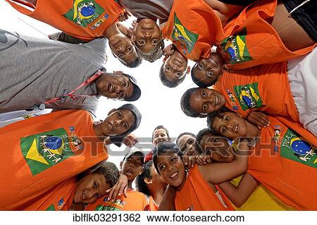 "Boys of a football team forming a circle, social project in a favela, Poxoreo, Mato Grosso, Brazil, South America" View Large Photo Image Stock Image - "Boys of a football team forming a circle, social project in a favela, Poxoreo, Mato Grosso, Brazil, South America". Fotosearch