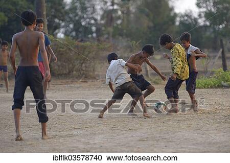 "Boys playing football, Bathi District, Takeo Province, Cambodia, Asia" View Large Photo Image Stock Image - "Boys playing football, Bathi District, Takeo Province, Cambodia, Asia". Fotosearch