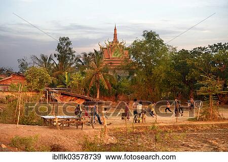 "Boys playing football in front of a pagoda, Bathi District, Takeo Province, Cambodia, Asia" View Large Photo Image Stock Photo - "Boys playing football in front of a pagoda, Bathi District, Takeo Province, Cambodia, Asia". Fotosearch