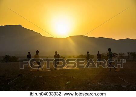"Boys playing soccer, Socotra, Yemen, Asia" View Large Photo Image Stock Image - "Boys playing soccer, Socotra, Yemen, Asia". Fotosearch