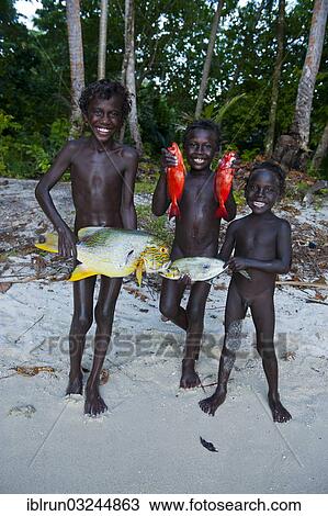 "Boys proudly showing the fish they caught, Marovo Lagoon, Western Province, Solomon Islands, Oceania" View Large Photo Image Stock Image - "Boys proudly showing the fish they caught, Marovo Lagoon, Western Province, Solomon Islands, Oceania". Fotosearch