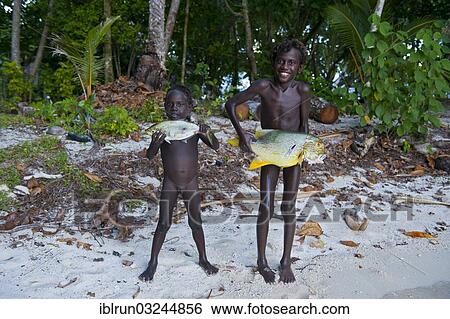 "Boys proudly showing the fish they caught, Marovo Lagoon, Western Province, Solomon Islands, Oceania" View Large Photo Image Stock Photograph - "Boys proudly showing the fish they caught, Marovo Lagoon, Western Province, Solomon Islands, Oceania". Fotosearch