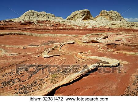 Stock Image - "Brain Rocks at White Pocket, eroded Navajo sandstone rocks with Liesegang bands or Liesegang rings, Pareah Paria Plateau, Vermillion Cliffs National Monument, Arizona, Utah, Southwestern USA, USA". Fotosearch