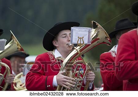 Stock Photo - "Brass player of the Weissensee marching band in traditional costume performing at the Naturparkfest festival in Techendorf, Carinthia, Austria, Europe". Fotosearch