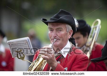 "Brass player of the Weissensee marching band in traditional costume performing at the Naturparkfest festival in Techendorf, Carinthia, Austria, Europe" View Large Photo Image Stock Photo - "Brass player of the Weissensee marching band in traditional costume performing at the Naturparkfest festival in Techendorf, Carinthia, Austria, Europe". Fotosearch