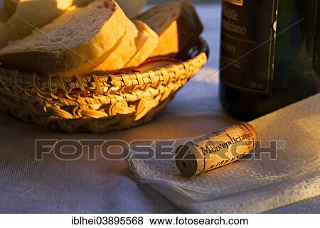 Stock Photo - "Bread basket with a bottle and a cork, Italy, Europe". Fotosearch