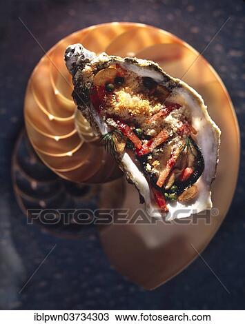 Breaded grilled oyster in its shell on another shell View Large Photo Image Stock Image - Breaded grilled oyster in its shell on another shell. Fotosearch