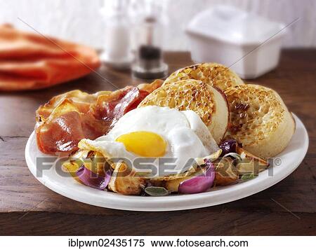 "Breakfast, crumpets, sauteed potatoes, fried egg and bacon" View Large Photo Image Stock Photography - "Breakfast, crumpets, sauteed potatoes, fried egg and bacon". Fotosearch
