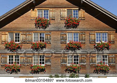 "Bregenzerwald house with geraniums jewelry, Baien, Reuthe, Bregenzerwald, Bregenzer Wald, Vorarlberg, Austria, Europe" View Large Photo Image Stock Photo - "Bregenzerwald house with geraniums jewelry, Baien, Reuthe, Bregenzerwald, Bregenzer Wald, Vorarlberg, Austria, Europe". Fotosearch