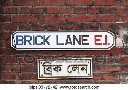 Stock Image - "Brick Lane street sign in English and Bengali, London, England, United Kingdom, Europe". Fotosearch